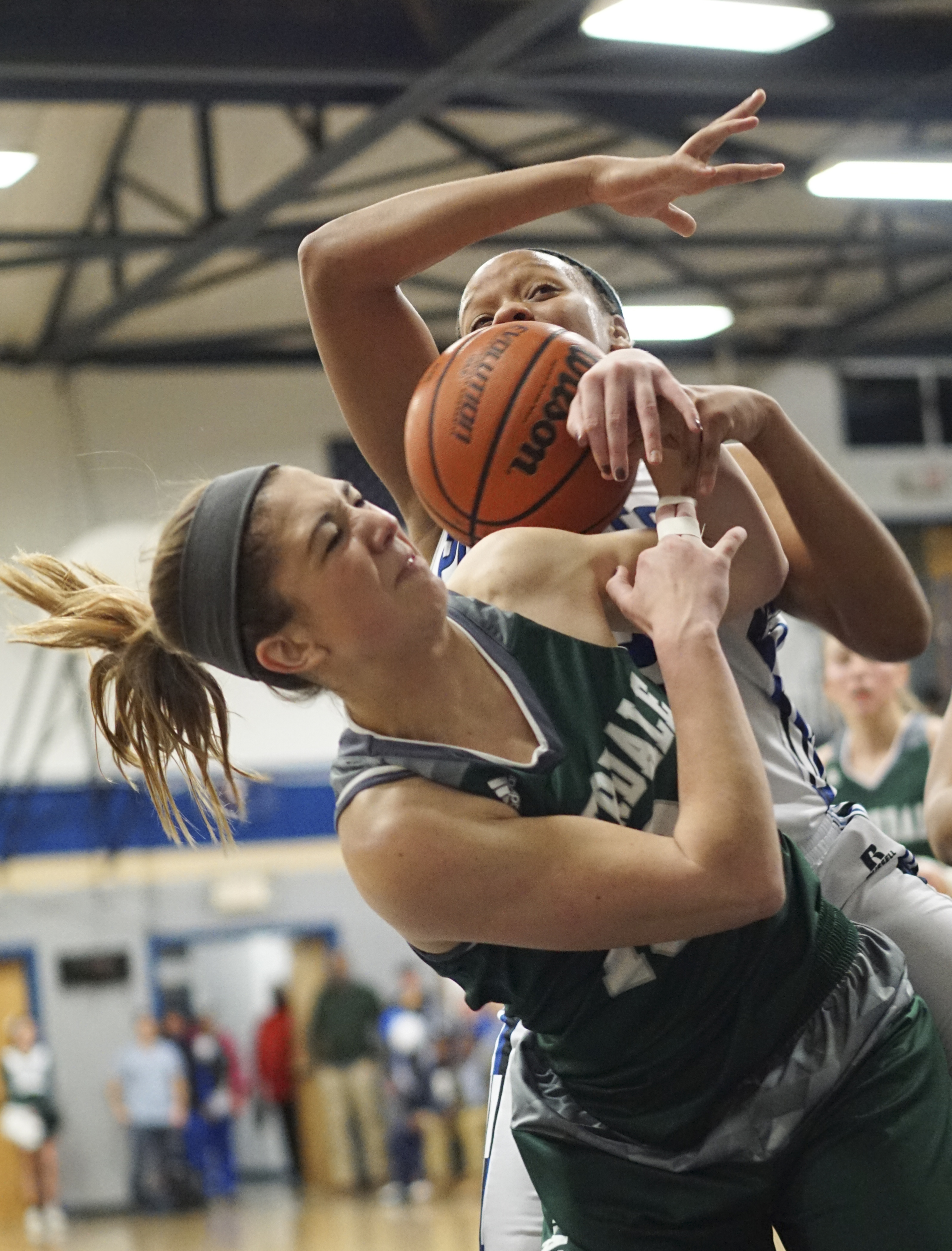 Staff Photo by Dan Henry / The Chattanooga Times Free Press- 2/12/16. Chattanooga School for the Arts and Sciences' Crystal Ealey (42) and Silverdale Baptist's Emily Skelton (10) battle for a rebound during their matchup at the Lady Patriot's home court on Friday, February 12, 2016. Arts and Sciences won over Silverdale with a final score of 49-44.