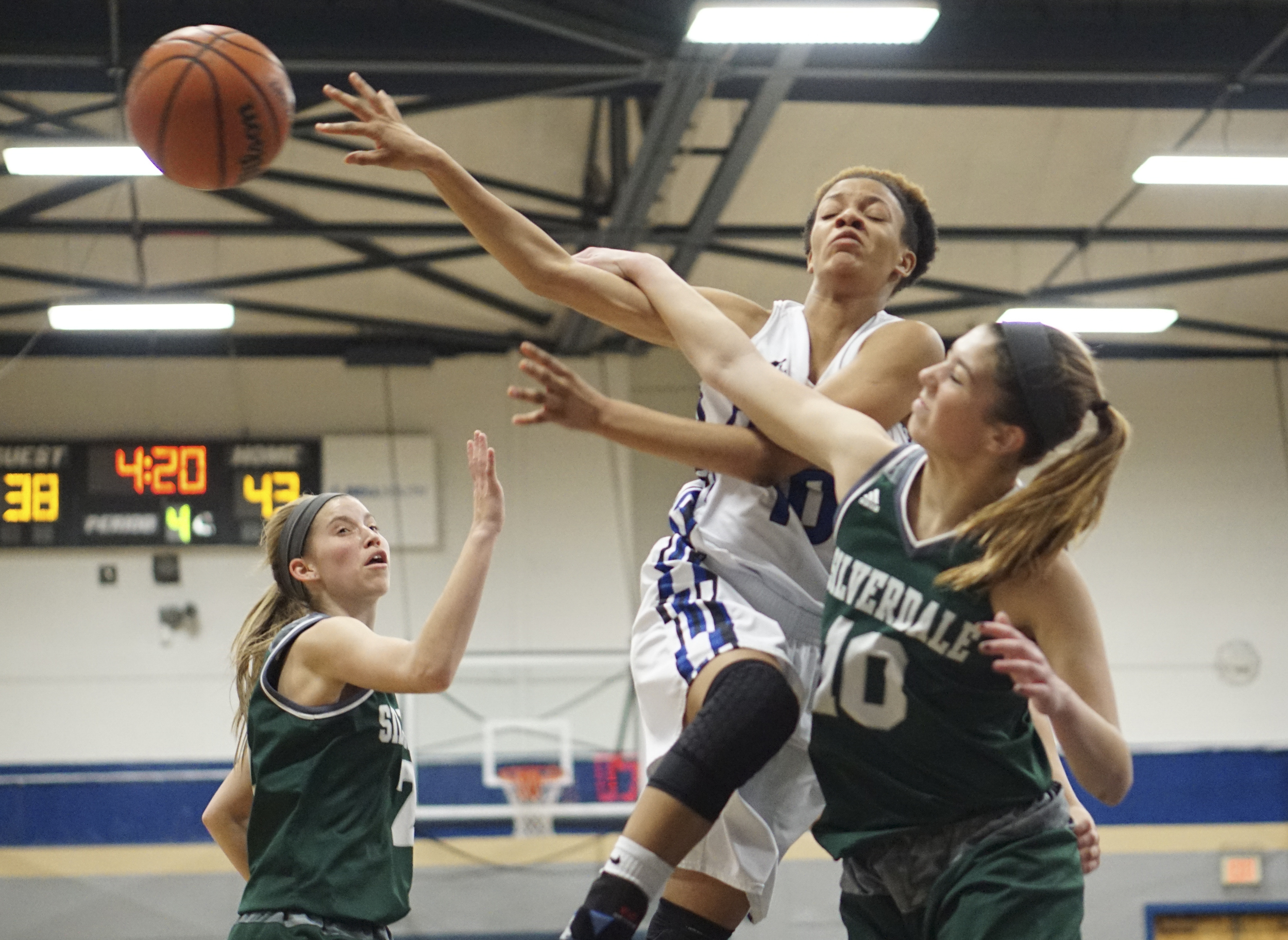 Staff Photo by Dan Henry / The Chattanooga Times Free Press- 2/12/16. Chattanooga School for the Arts and Sciences' Keturah Billen (10) makes a pass as Silverdale Baptist's Emily Skelton (10) presses during their matchup at the Lady Patriot's home court on Friday, February 12, 2016. Arts and Sciences won over Silverdale with a final score of 49-44.