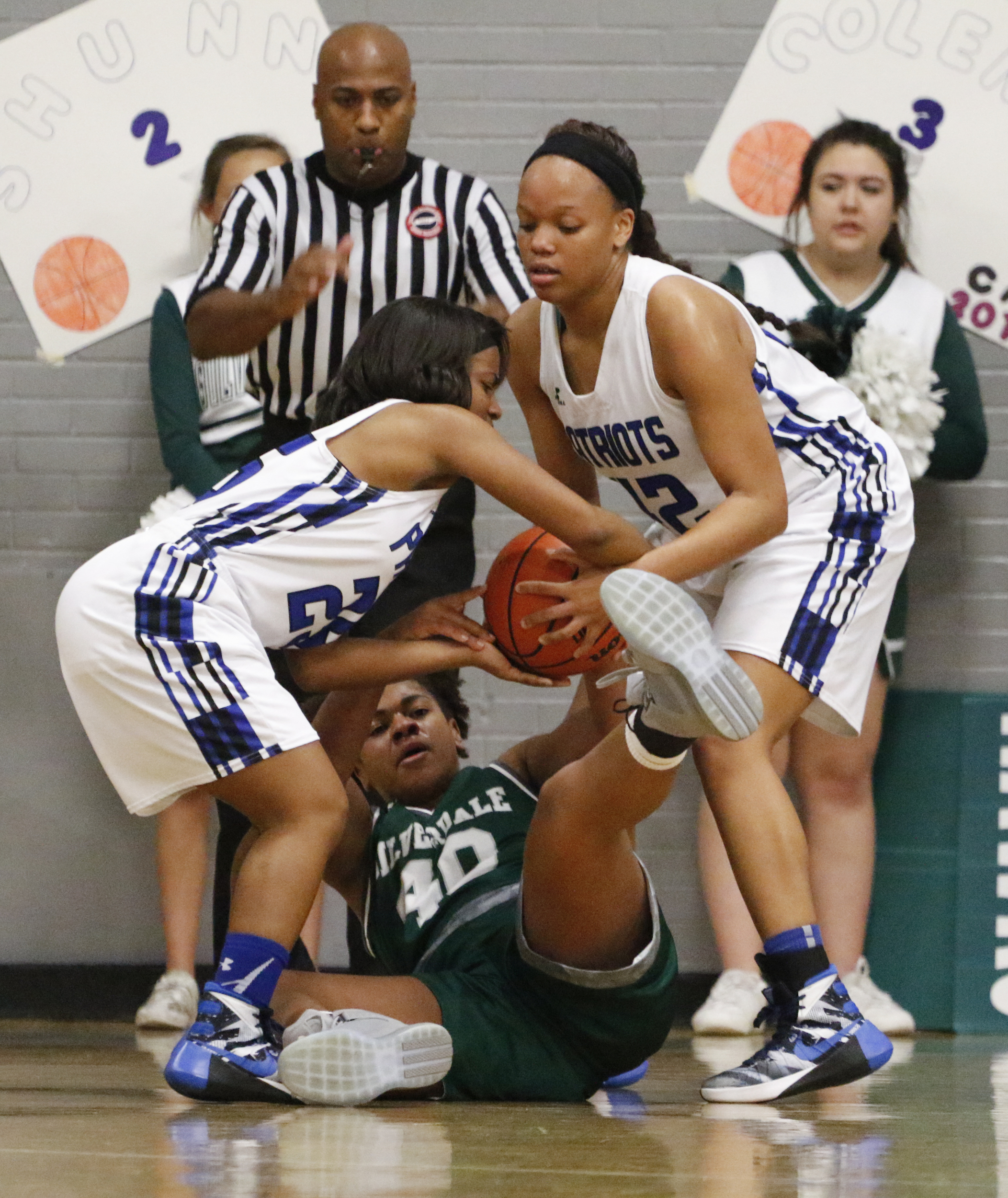 Staff Photo by Dan Henry / The Chattanooga Times Free Press- 2/12/16. Chattanooga School for the Arts and Sciences' Sheridan Randolph (25) and Crystal Ealey (42) battle Silverdale Baptist's Rachel Sanders (40) for possession of a loose ball during their matchup at the Lady Patriot's home court on Friday, February 12, 2016. Arts and Sciences won over Silverdale with a final score of 49-44.