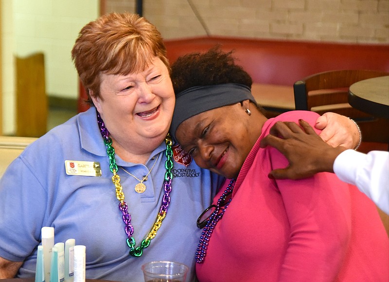 Claudette Andrews, left, laughs with Gloria Harris at the 2nd annual Mardi Bra party Friday, February 12, 2016 at the Salvation Army.