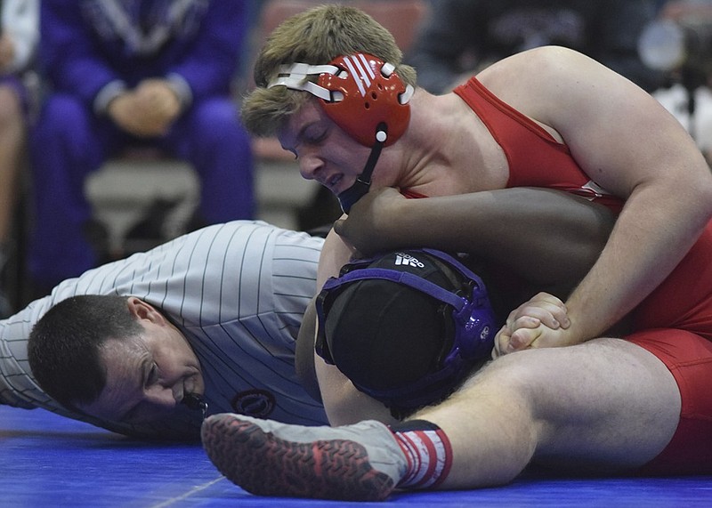 Baylor's Ryan Parker pins Father Ryan's Preston Cook in the 195-pound class.  Montgomery Bell Academy, Father Ryan, Baylor and McCallie wrestled Friday night at the McCallie School