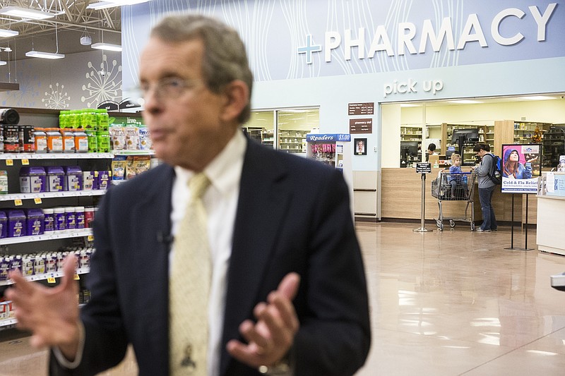 
              Ohio Attorney General Mike DeWine is interviewed as customers visit the pharmacy during a news conference at the Oakley Kroger Marketplace store to announce the supermarket chain's decision to offer the opioid overdose reversal medicine Naloxone without a prescription, Friday, Feb. 12, 2016, in Cincinnati. Naloxone is routinely carried by fire-rescue crews, which use it thousands of times a year in Ohio to revive overdose victims. Kroger, based in Cincinnati, has 2,774 supermarkets and multi-department stores in 35 states and the District of Columbia. (AP Photo/John Minchillo)
            