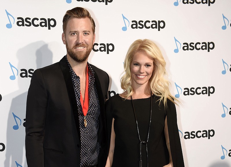 
              FILE - In this Nov. 23, 2015 file photo, Charles Kelley, of Lady Antebellum, and his wife Cassie arrive at the 53rd Annual ASCAP Country Music Awards in Nashville, Tenn.  The couple, announced the birth of their first child, Ward Charles Kelley. The birth announcement was posted Thursday, Feb. 11, 2016, on Womanista.com, a website Cassie Kelley founded. (Photo by Sanford Myers/Invision/AP, File)
            