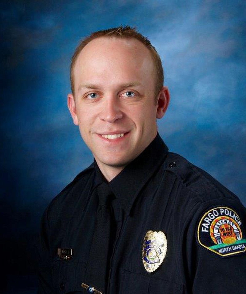 
              This undated photo released by Fargo Police Department shows Fargo police officer Jason Moszer. Moszer was shot amid a standoff in Fargo, N.D. with a domestic violence suspect, police in North Dakota said early Thursday, Feb. 10, 2016. Moszer, 33, responded to the standoff Wednesday night and parked near the home the suspect was barricaded inside, Fargo Deputy Police Chief Joe Anderson said. (Fargo Police Department via AP)  MANDATORY CREDIT
            