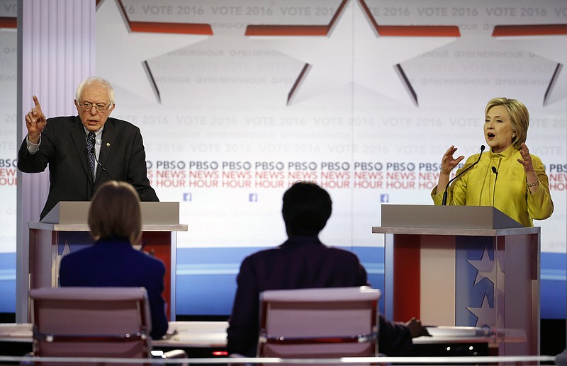 Democratic presidential candidates, Sen. Bernie Sanders, I-Vt., and Hillary Clinton argue a point during a Democratic presidential primary debate at the University of Wisconsin-Milwaukee, Thursday, Feb. 11, 2016, in Milwaukee.