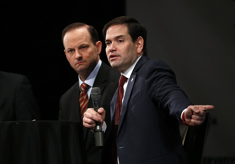 
              Republican presidential candidate, Sen. Marco Rubio, R-Fla., accompanied by South Carolina Attorney General Alan Wilson, speaks during a Faith and Family Presidential Forum at Bob Jones University, Friday, Feb. 12, 2016, in Greenville, S.C. (AP Photo/Paul Sancya)
            