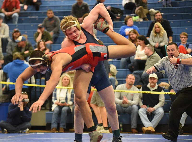 Soddy-Daisy's Tucker Russo drives Ooltewah's Jordan Chafi to the mat to take a 18-8 major decision in the 160-pound class at Saturday's Region 4-AAA wrestling tournament at Cleveland Middle School.