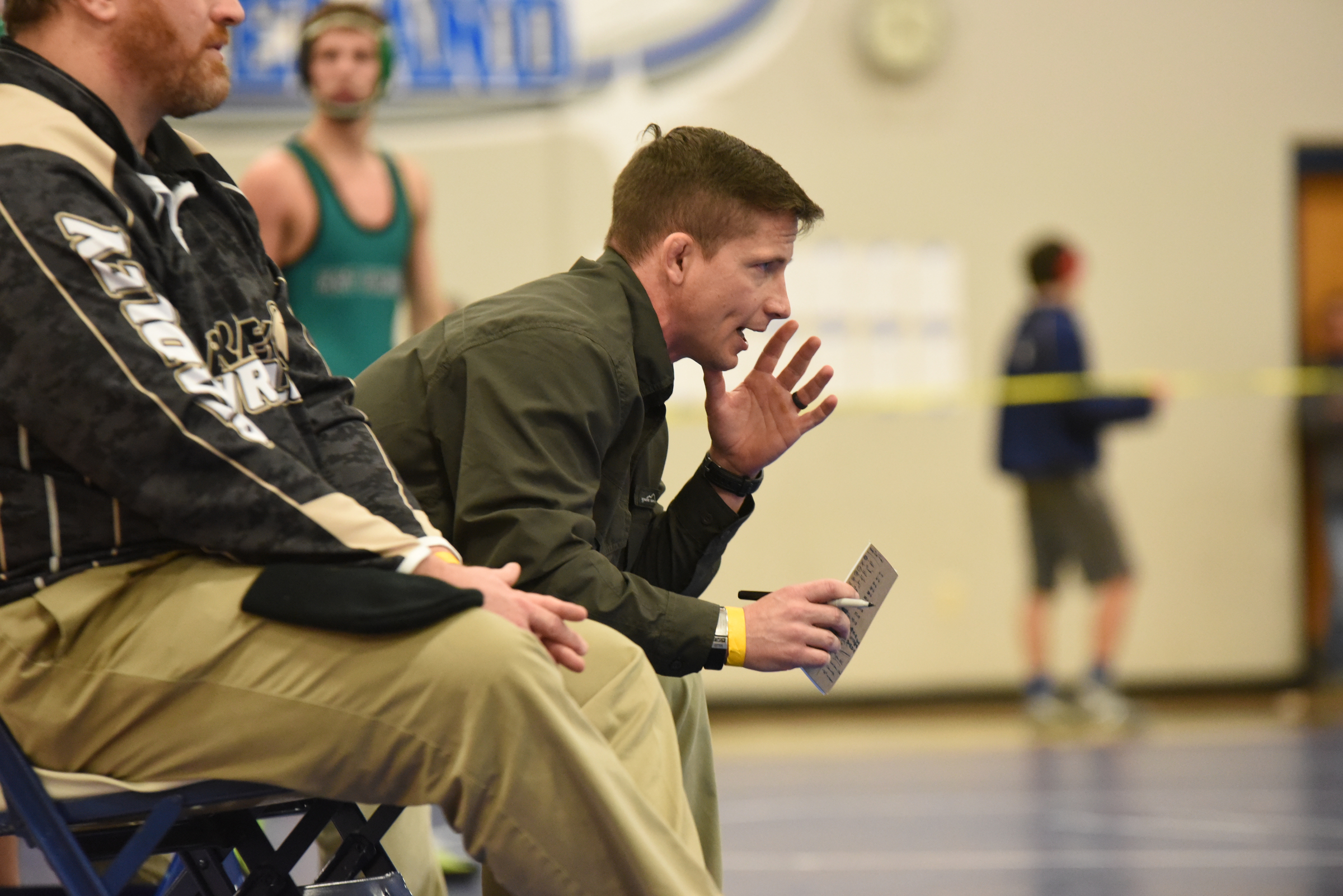 Bradley Central wrestling coach Ben Smith instructs his man during Saturday's Region 4-AAA wrestling tournament held at Cleveland Middle School.