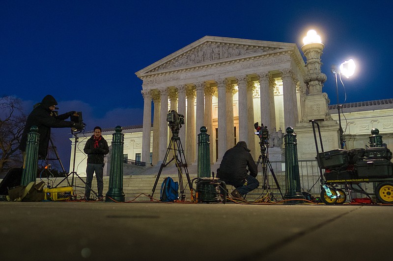 
              Television news crews set up in front of the U.S. Supreme Court building in Washington, Saturday, Feb. 13, 2016. On Saturday, the U.S. Marshals Service confirmed that Justice Antonin Scalia has died at the age of 79. (AP Photo/J. David Ake)
            