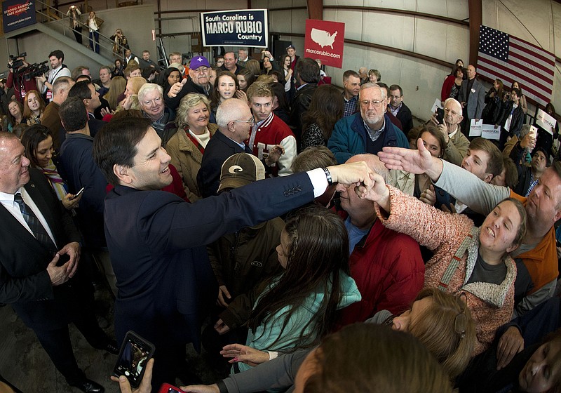
              Republican presidential candidate Sen. Marco Rubio, R-Fla., greets supporters after speaking at a rally at Greenville Downtown Airport  Friday, Feb. 12, 2016, in Greenville, S.C. (AP Photo/John Bazemore)
            