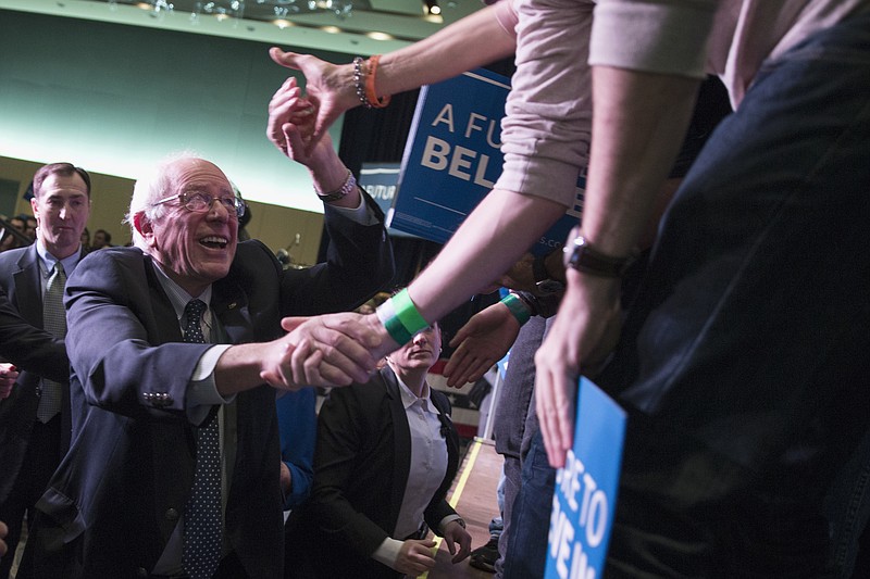 
              Democratic presidential candidate, Sen. Bernie Sanders, I-Vt. shakes hands during a canvass kick-off event at the Reno Sparks Convention Center, Saturday, Feb. 13, 2016, in Reno, Nev. (AP Photo/Evan Vucci)
            