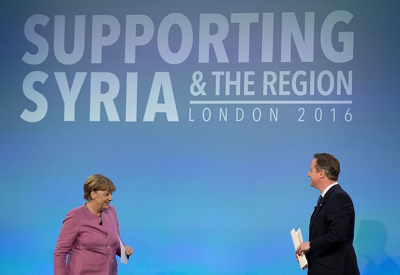 
              FILE - In this file photo dated Thursday, Feb. 4, 2016, British Prime Minister David Cameron, right, walks back to his seat on the stage after speaking, as German Chancellor Angela Merkel gets up for her turn to speak during a press conference near the end of the 'Supporting Syria and the Region' conference at the Queen Elizabeth II Conference Centre in London.  Britain is demanding concessions from Europe ahead of a planned public referendum on the so called Brexit, or Britain Exit, deciding whether Britain will abandon the 28-nation European Union. (AP Photo/Matt Dunham, File)
            
