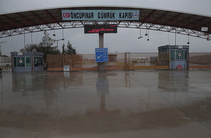 
              FILE - In this file photo dated Saturday, Feb. 6, 2016, the Turkish border crossing with Syria, is closed near to the town of Kilis, in southeastern Turkey, as some thousands of Syrian migrants are known to be moving toward the border, fleeing from fierce fighting inside Syria. Despite the wintry weather in southern Europe, the flow of migrants has not abated and European countries are trying to impose order on its external border, while keeping the cherished notion of freedom of movement across European internal borders.  (AP Photo/Lefteris Pitarakis, File)
            