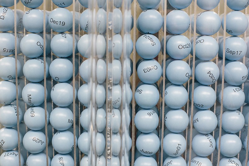 Blue plastic balls with dates used by Selective Services when choosing numbers for the military draft in Arlington, Va.. With the Defense Department opening combat roles to women, the Marine Corps commandant, the chief of staff of the Army and one of the top Democrats on the Senate Armed Services Committee said last week that women should be required to register for the Select Services draft.