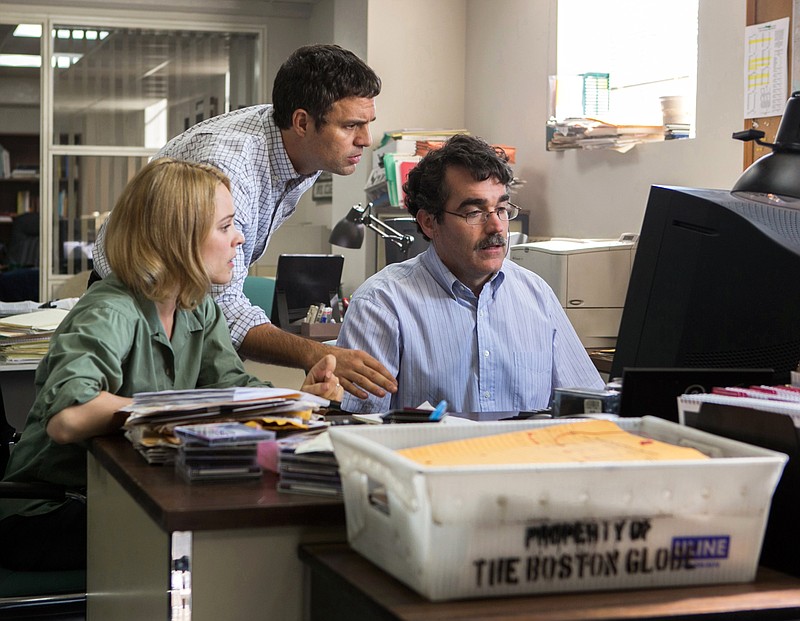 FILE - This photo provided by courtesy of Open Road Films shows, Rachel McAdams, from left, as Sacha Pfeiffer, Mark Ruffalo as Michael Rezendes and Brian d'Arcy James as Matt Carroll, in a scene from the film, "Spotlight." Oscar contenders "Spotlight" and "The Big Short" won the top awards for screenwriting from the Writers Guild of America at a ceremony Saturday, Feb. 13, 2016, that was held in Los Angeles and New York.  (Kerry Hayes/Open Road Films via AP, File)
            