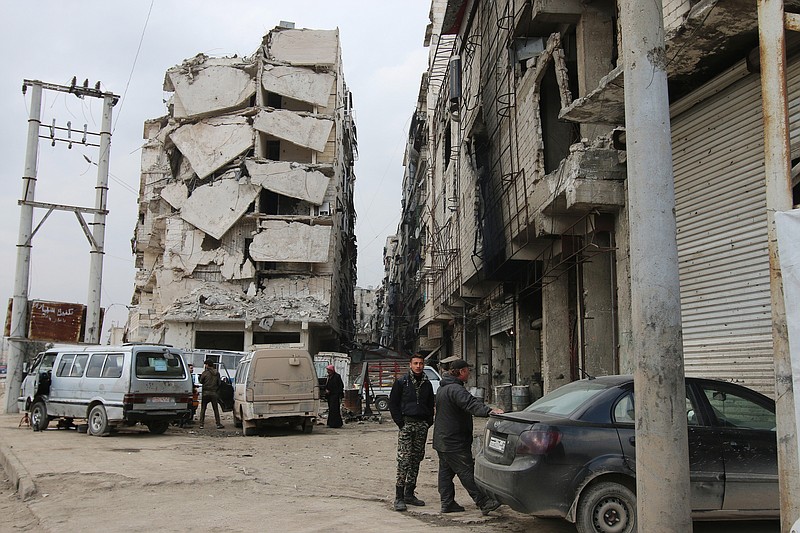 
              In this Thursday, Feb. 11, 2016 photo, a building is seen with heavy damage in Aleppo, Syria. The fighting around Syria's largest city of Aleppo has brought government forces closer to the Turkish border than at any point in recent years, routing rebels from key areas and creating a humanitarian disaster as tens of thousands of people flee. (Alexander Kots/Komsomolskaya Pravda via AP)
            