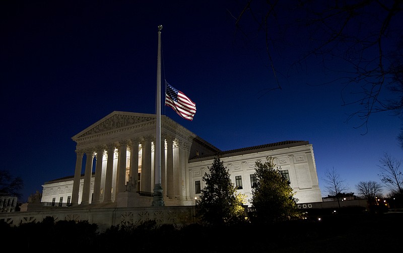 
              An American flag flies at half-staff in front of the U.S. Supreme Court building in honor of Supreme Court Justice Antonin Scalia as the sun rises in Washington, Sunday, Feb. 14, 2016. Scalia, the influential conservative and most provocative member of the Supreme Court, has died. He was 79. (AP Photo/Manuel Balce Ceneta)
            