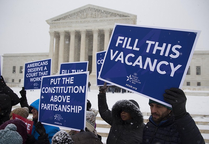 Protesters from the "People for the American Way" outside of the Supreme Court in Washington on Monday. (Doug Mills/The New York Times)