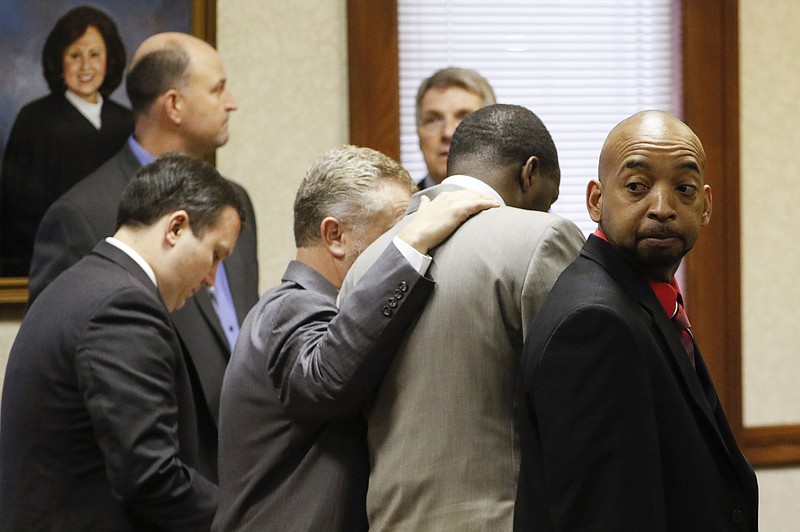Staff Photo by Dan Henry / The Chattanooga Times Free Press- 2/15/16. Ooltewah High School head basketball coach Andre "Tank" Montgomery looks into the crowd during a brief intermission from his preliminary hearing in Hamilton County Juvenile Court on February 15, 2016. Hamilton County District Attorney Neal Pinkston charged head coach Andre "Tank" Montgomery, assistant coach Karl Williams and Athletic Director Allard "Jesse" Nayadley with failing to report child abuse or suspected child sexual abuse in connection with the rape of an Ooltewah High School freshman by his basketball teammates Dec. 22, 2015. 
