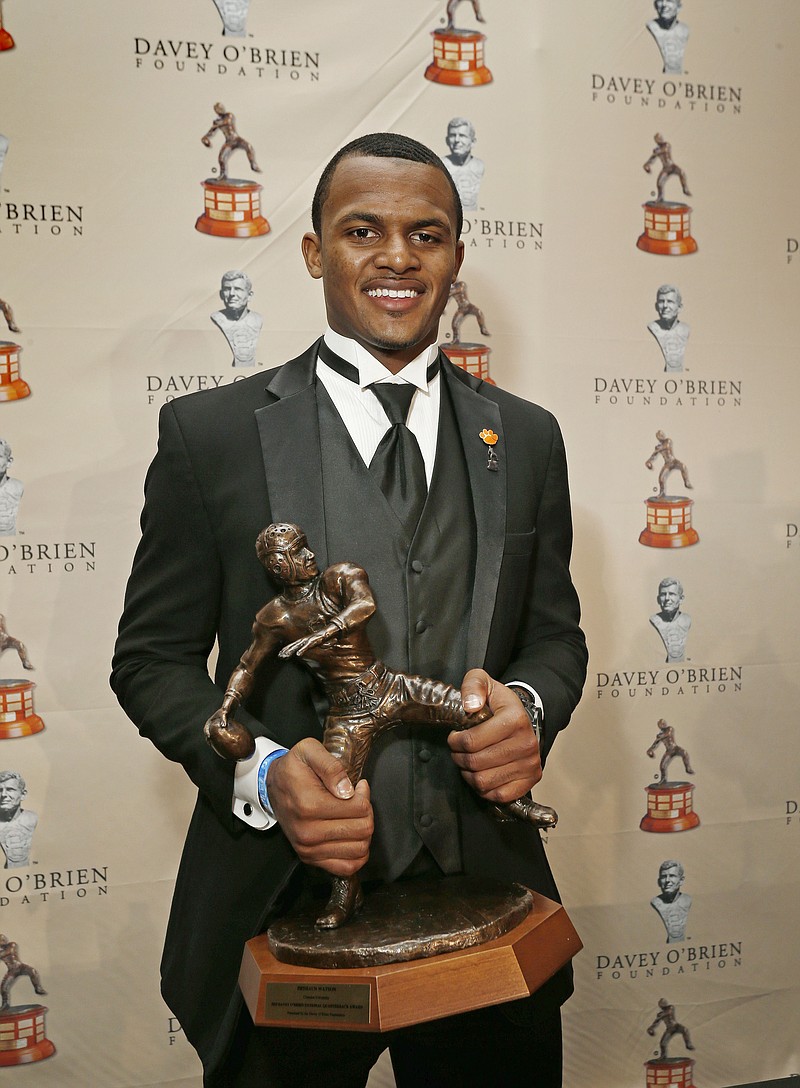 
              Deshaun Watson, from Clemson University, poses for a photo after he received the Davey O'Brien Award as the nation's top NCAA quarterback, in Fort Worth, Texas, Monday, Feb. 15, 2016. (Paul Moseley/Star-Telegram via AP) MANDATORY CREDIT
            