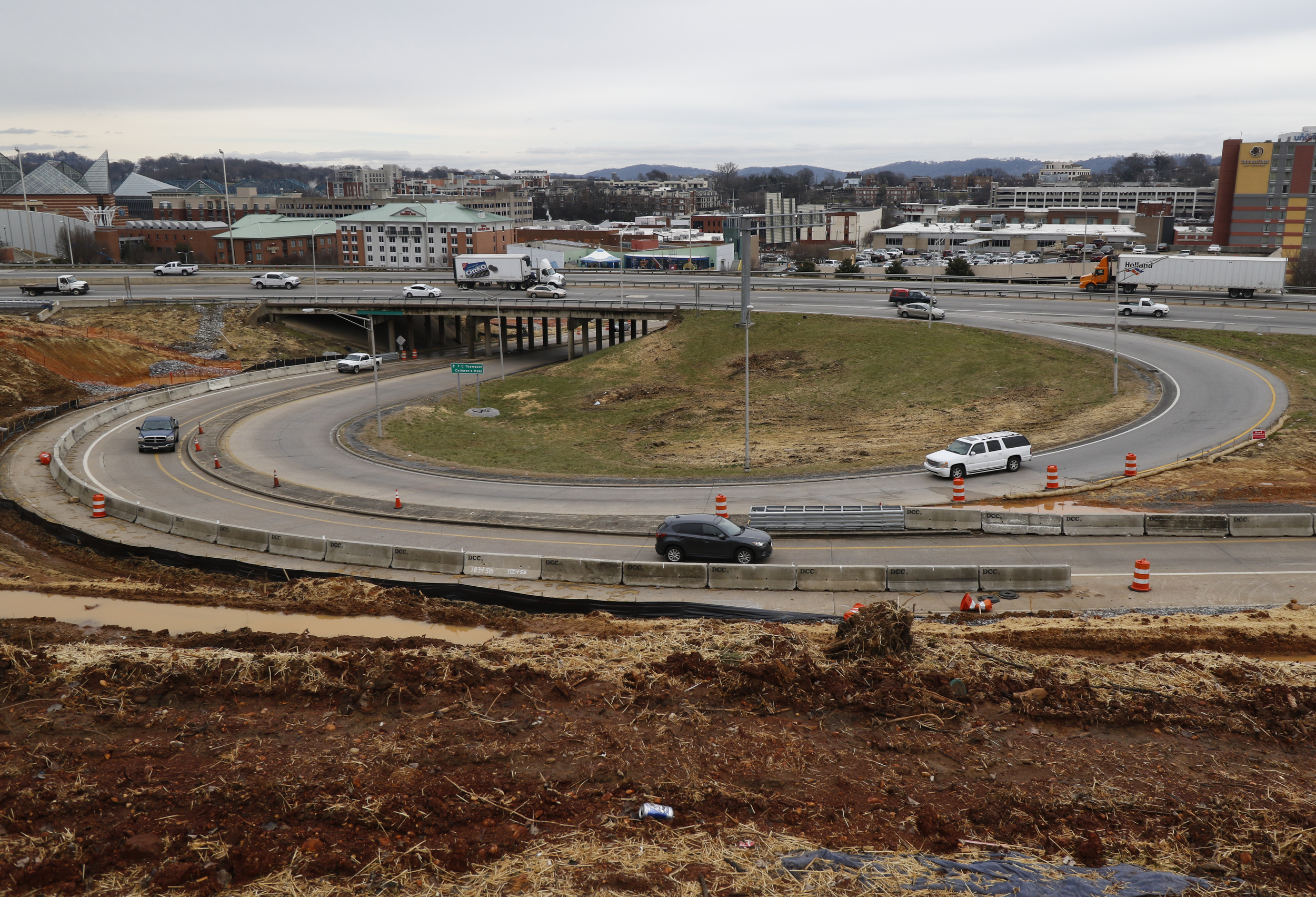 Staff Photo by Dan Henry / The Chattanooga Times Free Press- 2/16/16. Motorists drive past the US 27 expansion in downtown Chattanooga on Tuesday, February 16, 2016. Recent precipitation has saturated the ground and caused some area construction projects to be delayed.