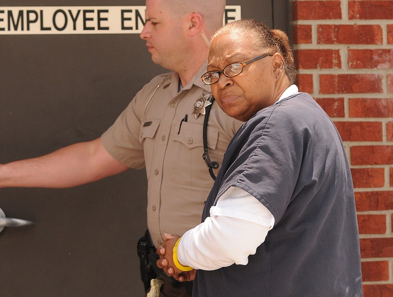 Clara Louise Edwards is escorted into the Catoosa County Courthouse on June 27, 2014, for a hearing in the death of 2-year-old Saharah Weatherspoon.