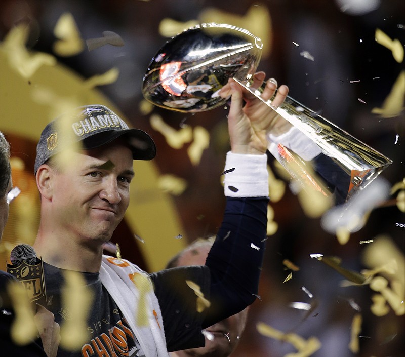 FILe - In this Feb. 7, 2016, file photo, Denver Broncos Peyton Manning holds up the trophy after the NFL Super Bowl 50 football game in Santa Clara, Calif. The lawyer for six women suing the University of Tennessee on its handling of sexual assault complaints by student-athletes is focused on the schools systemic problems he believes exist and is surprised at the attention the complaints brief mention of Peyton Manning generated. (AP Photo/Matt York, File)