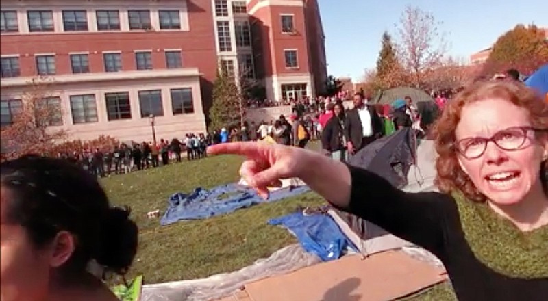 FILE - This Nov. 9, 2015 file frame grab provided by Mark Schierbecker shows Melissa Click, right, an assistant professor in the University of Missouri's communications, during a run-in with student journalists at a campus protest that followed the resignations of the university system's president and the Columbia campus' chancellor in Columbia, Mo. Click, who confronted a student photographer and another student videographer during the protests and called for 'muscle' to remove them, was charged with misdemeanor assault on Monday, Jan. 25, 2106. (Mark Schierbecker via AP, File) 
