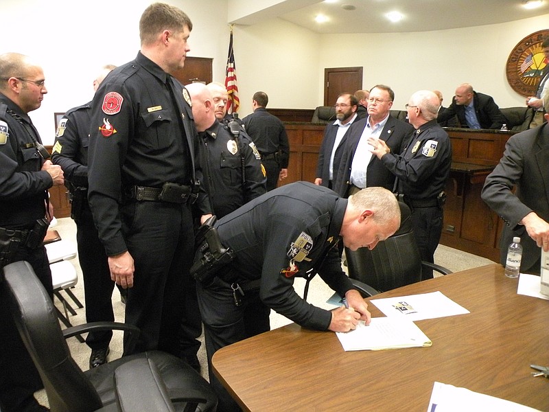 Officers from the Red Bank Police Department reaffirm their commitment to serving Red Bank as a group at the Feb. 2 City Commission meeting, re-acknowledging the Law Enforcement Oath of Honor and swearing the Police Officer Oath of Office before City Judge Johnny Houston.