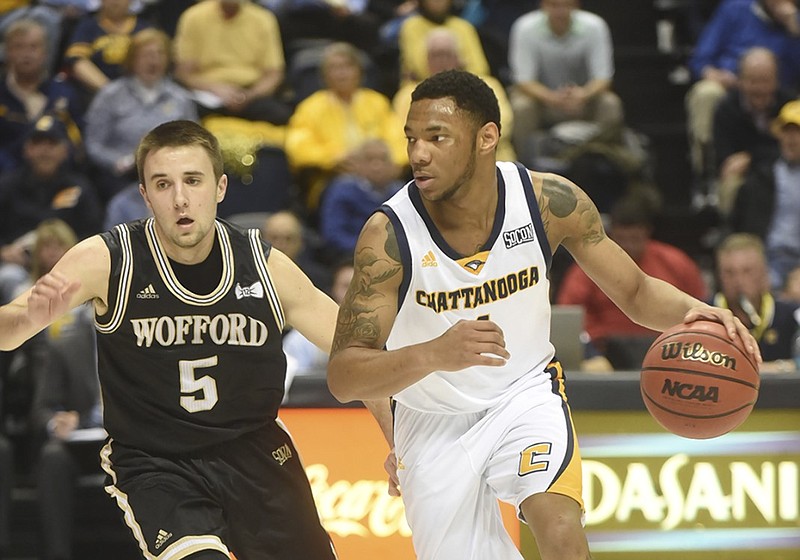 UTC's Johnathan Burroughs-Cook is guarded by Wofford's Eric Garcia during a SoCon game earlier this month at McKenzie Arena. The Mocs host VMI tonight.