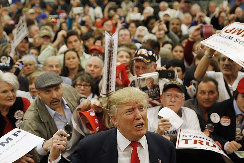 
              Republican presidential candidate Donald Trump speaks speaks with members of the media as he meets with attendees during a campaign stop, Friday, Feb. 19, 2016, in Myrtle Beach, S.C. (AP Photo/Matt Rourke)
            