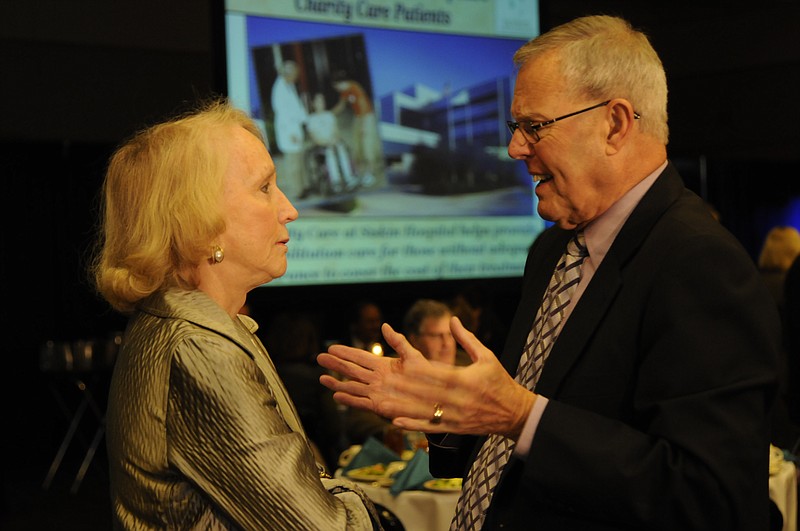 Former UTC chancellor Dr. Fred Obear, shown chatting with Bettye Emerson at Siskin Hospital's "Possibilities Luncheon" a few years ago, is being honored along with his wife with the Fred Gregg Jr. Memorial Award.