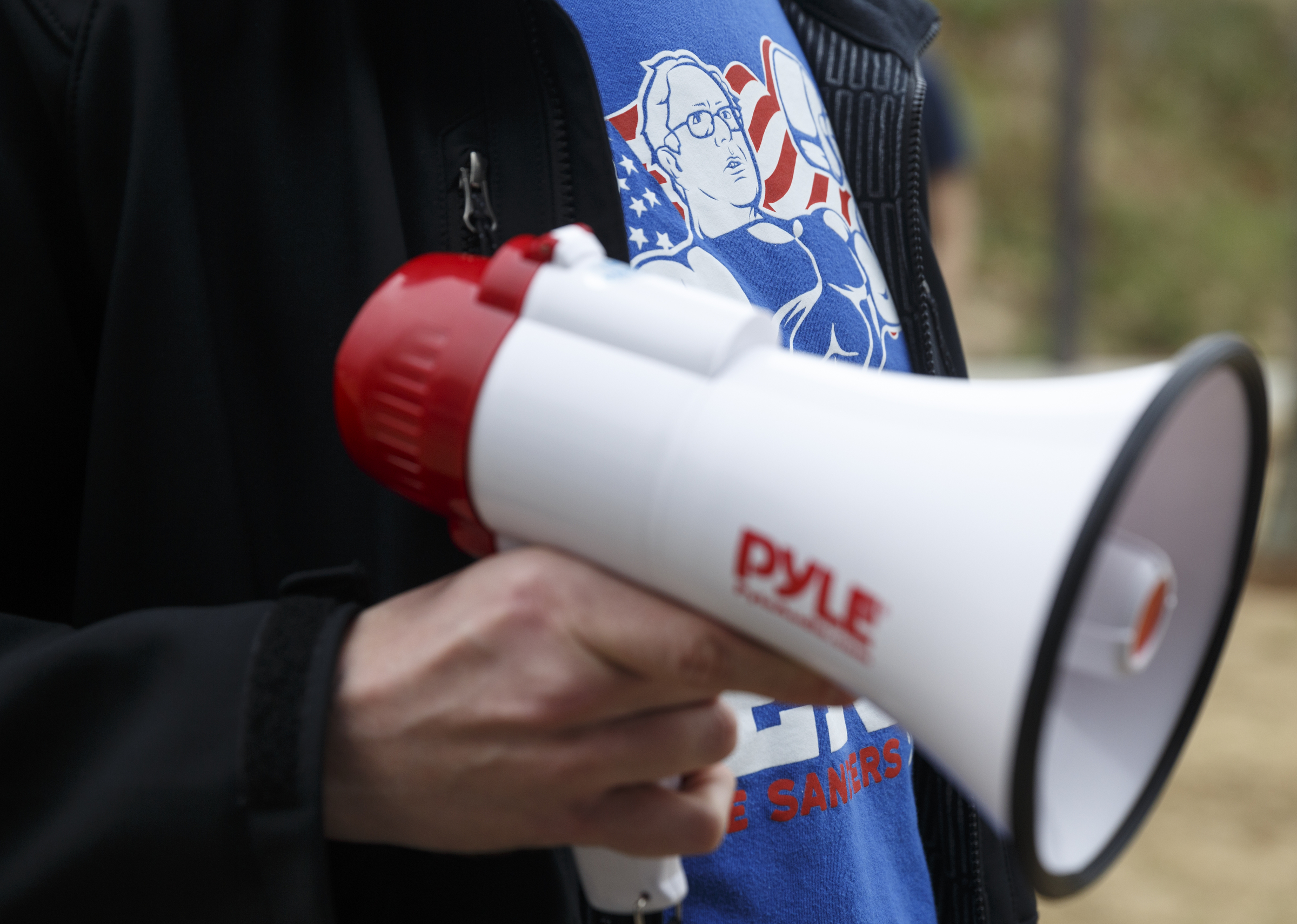 Robert Holder carries a megaphone and wears a Sanders shirt during a rally for Democratic presidential primary candidate Bernie Sanders held at Renaissance Park on Saturday, Feb. 20, 2016, in Chattanooga, Tenn. Supporters then marched across the Market Street Bridge to show their support.