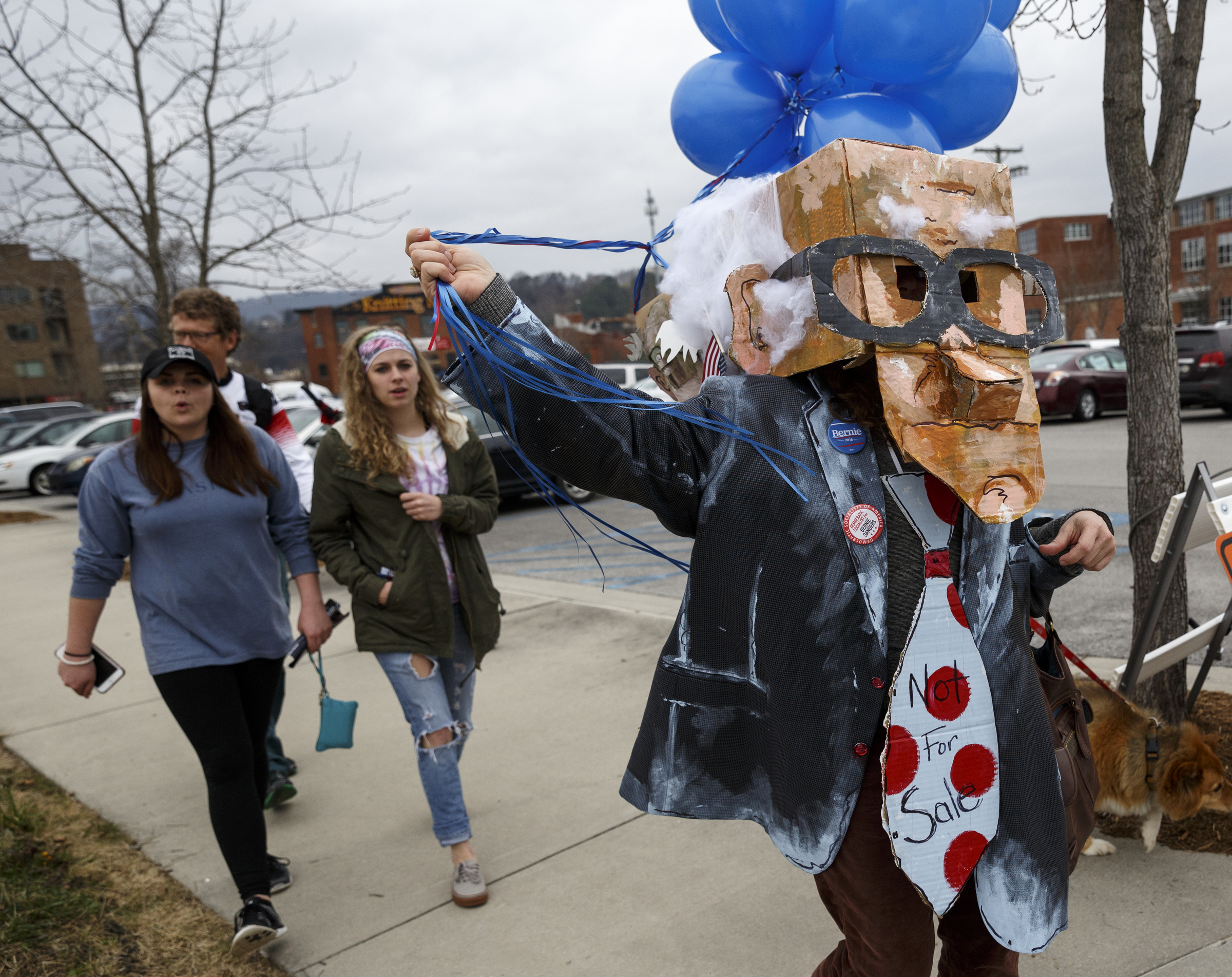 Becky Bolding wears a Sanders costume as she marches during a rally for Democratic presidential primary candidate Bernie Sanders held at Renaissance Park on Saturday, Feb. 20, 2016, in Chattanooga, Tenn. Supporters then marched across the Market Street Bridge to show their support.