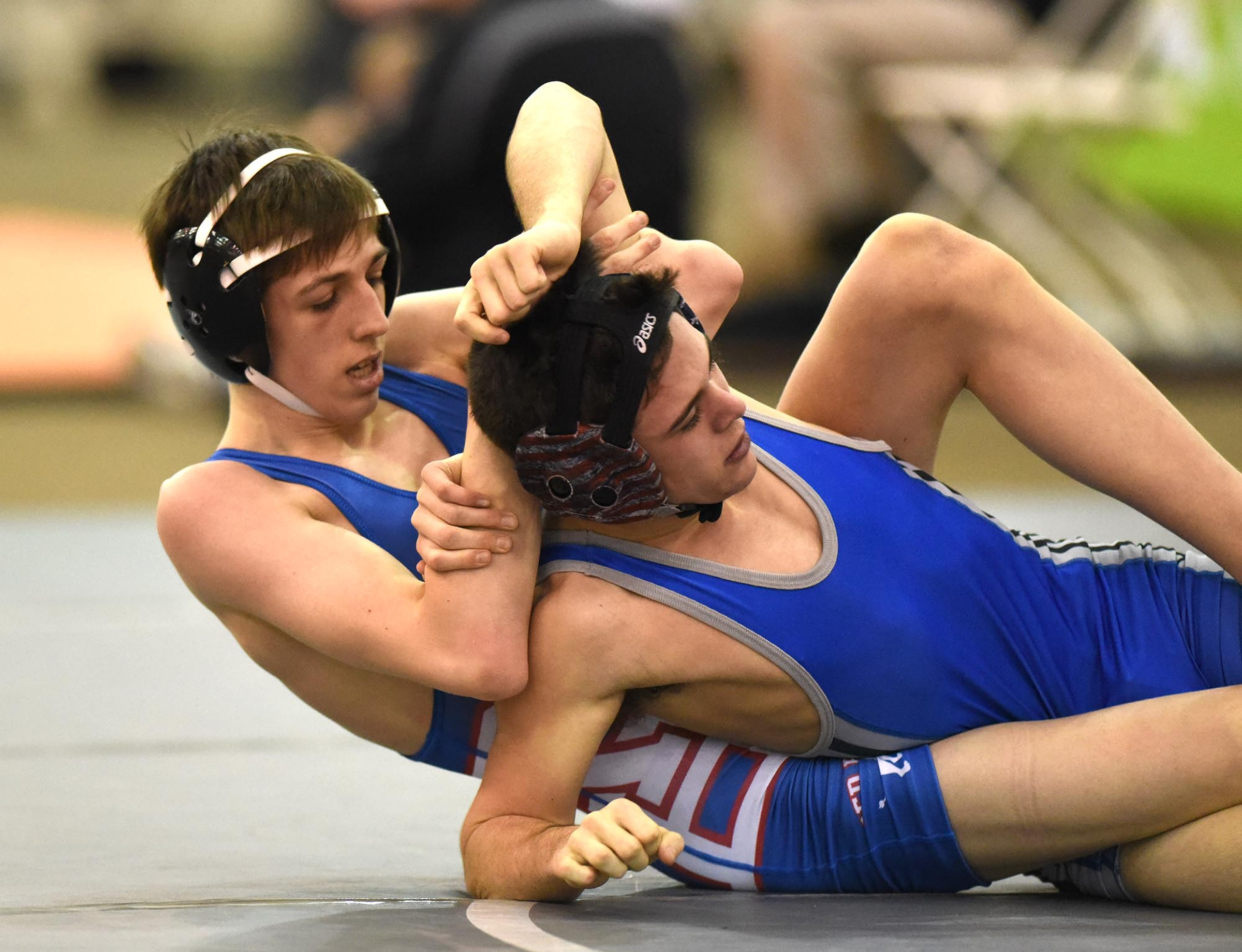 Red Bank's Blake Reichel (left) works to turn Forrest's Dylan Pendley in the 113 pound class. Reichel won the match. The finals of the TSSAA State Wrestlings Championships were held at the Williamson Agricultural Center in Franklin, Tn. on February 20, 2016.