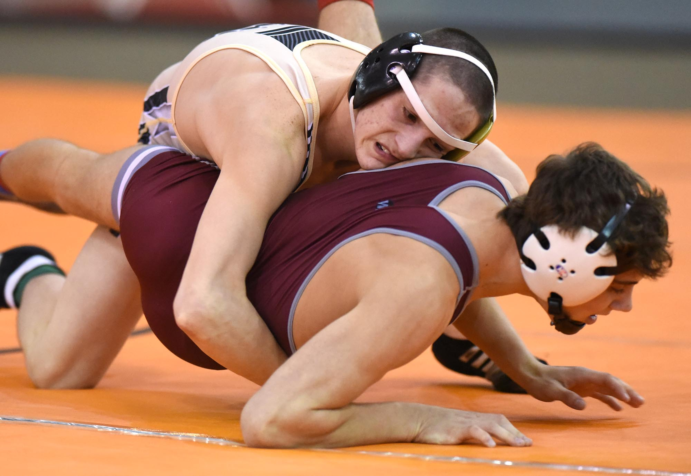 Ryan McElhaney of Bradley Central (top) turns Bearden's Kyle Burns in the 120 pound class. McElhaney won the match. The finals of the TSSAA State Wrestlings Championships were held at the Williamson Agricultural Center in Franklin, Tn. on February 20, 2016.