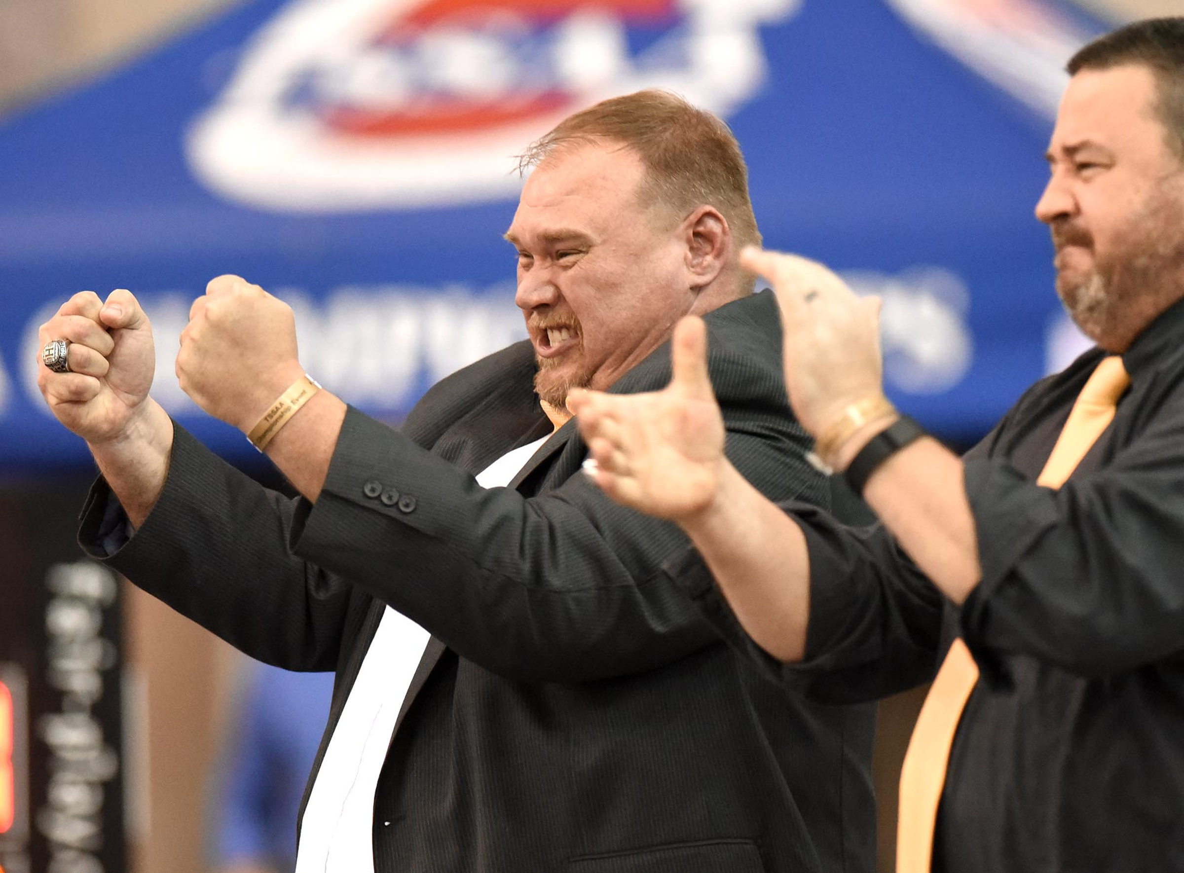 Hixson head coach Garrick Hall (left) reacts as Landon Goforth wins the state championship, at right is assistant Casey Thompson. Goforth's title was the first state championship for a wrestler under Hall's coaching. The finals of the TSSAA State Wrestlings Championships were held at the Williamson Agricultural Center in Franklin, Tn. on February 20, 2016.