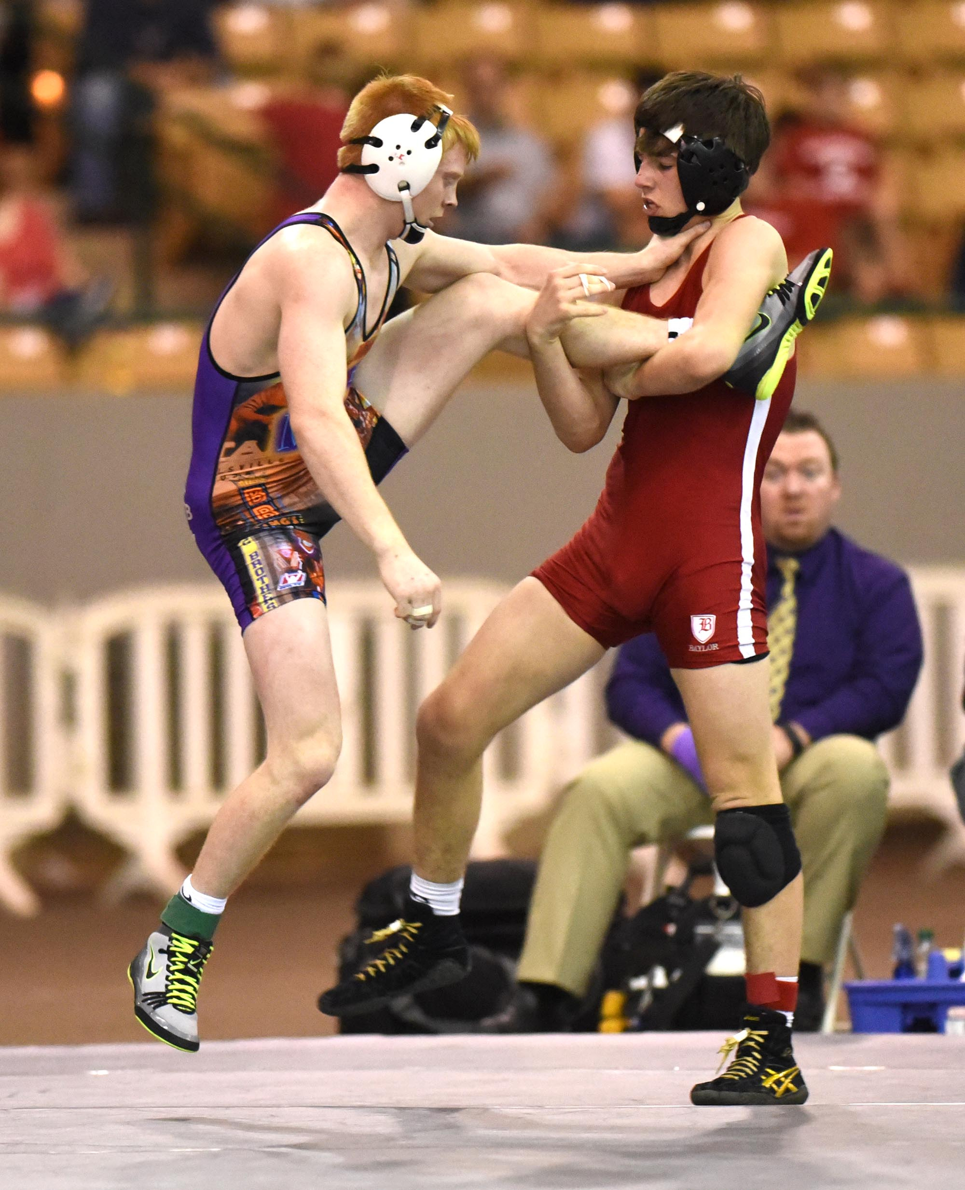 Baylor's Mason Reiniche (right) tries to get his foot around Drew Nicholson of Christian Brothers in the 152 pound match. Reiniche won the title. The finals of the TSSAA State Wrestlings Championships were held at the Williamson Agricultural Center in Franklin, Tn. on February 20, 2016.