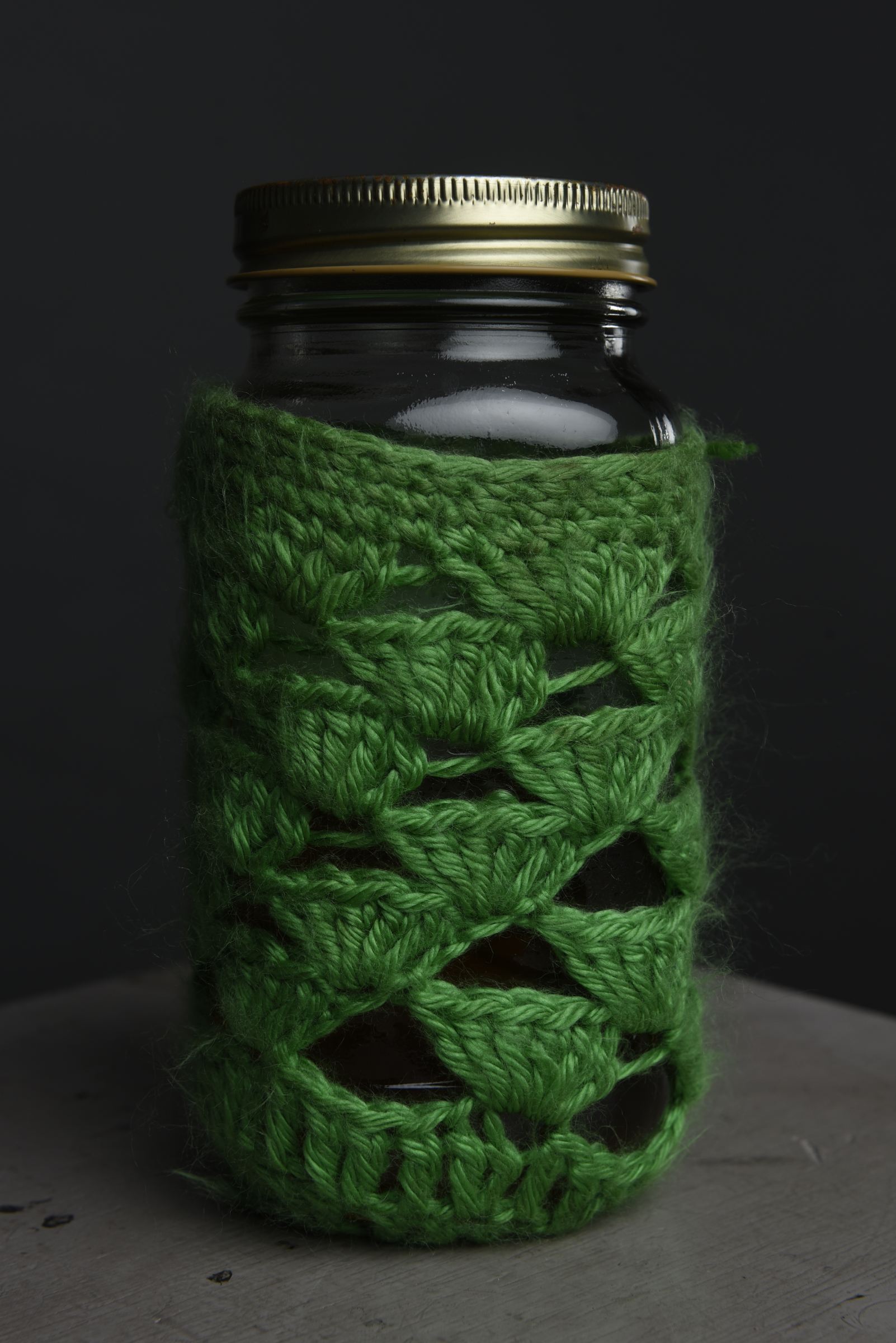 Photographed Monday, Feb. 1, 2016, in Chattanooga, Tenn., Tiffany Malapanes , the founder of Positiffitea, drinks her tea from a canning jar cushioned in a crocheted sleeve.