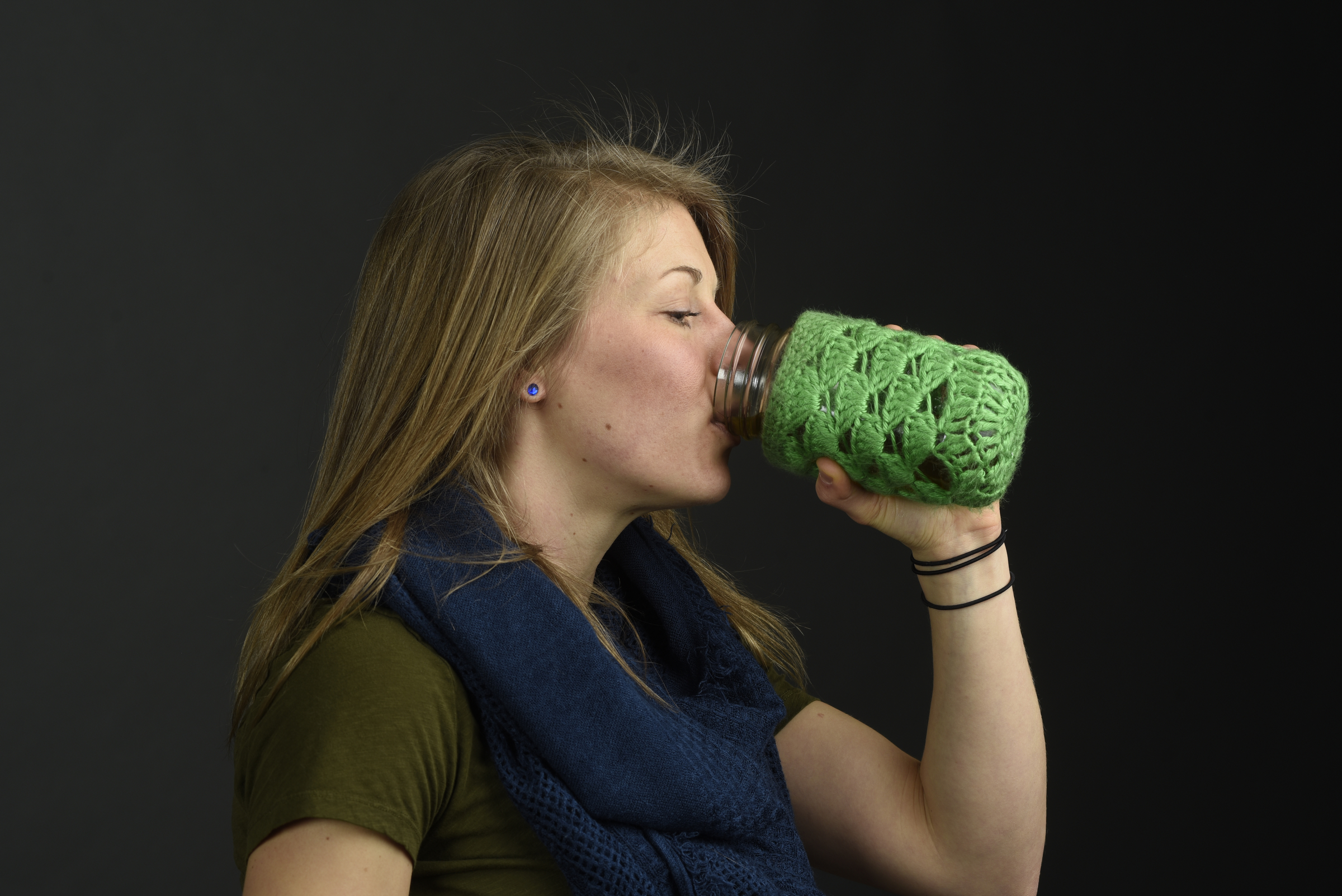 Photographed Monday, Feb. 1, 2016, in Chattanooga, Tenn., Tiffany Malapanes , the founder of Positiffitea, drinks her tea from a canning jar cushioned in a crocheted sleeve.