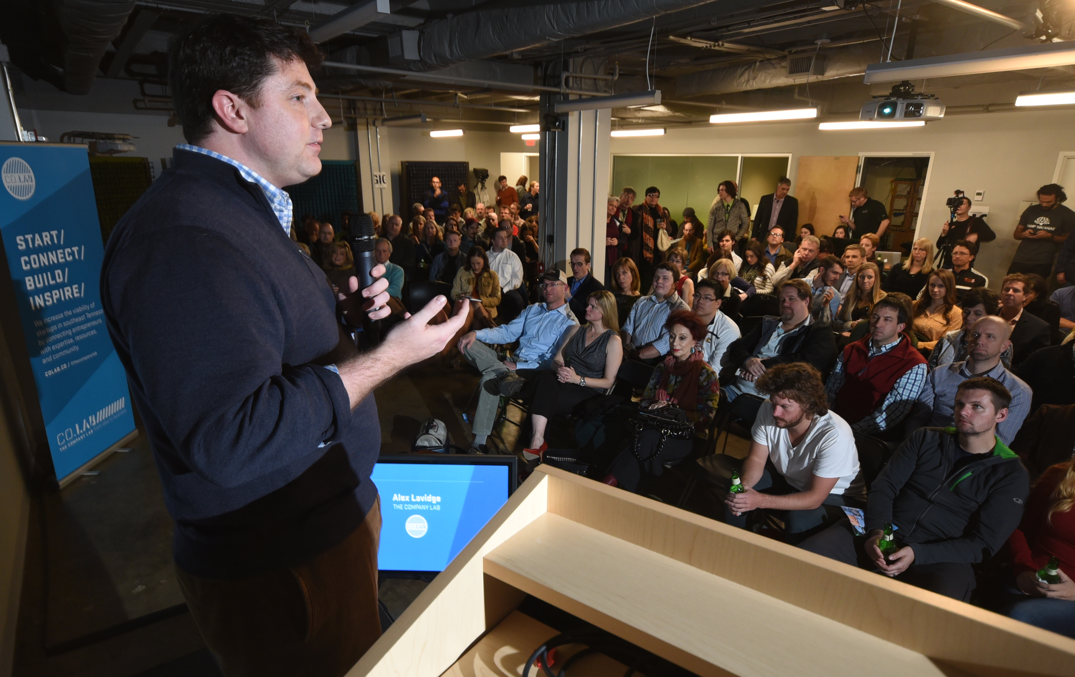 Alex Lavidge makes opening remarks in late January at the Company Lab's Pitch Night on the fifth floor of the Edney Building.