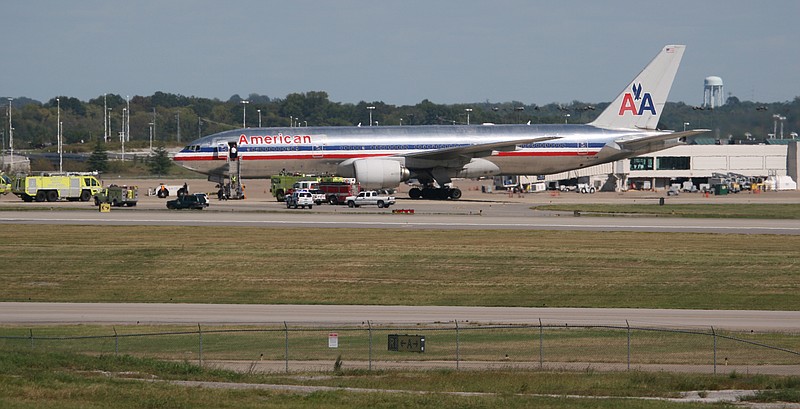 In this 2011 file photo, emergency vehicles surround an American Airlines Boeing 777 after it made an emergency landing at the Nashville International Airport in Nashville, Tenn.