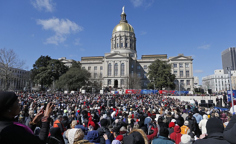 Liberty Plaza is filled to capacity with attendees of a "prayer rally" led by Evangelist Rev. Franklin Graham near the state Capitol, in Atlanta, Wednesday, Feb. 10, 2016. The rally was held as a powerful Georgia Senate committee is set to consider a bill allowing religious adoption agencies, schools, government workers and others to refuse services to same-sex couples without being penalized. The Senate Rules committee hearing is set for the same day Graham's father Billy Graham brings his "Decision America Tour 2016" to the Georgia state Capitol.