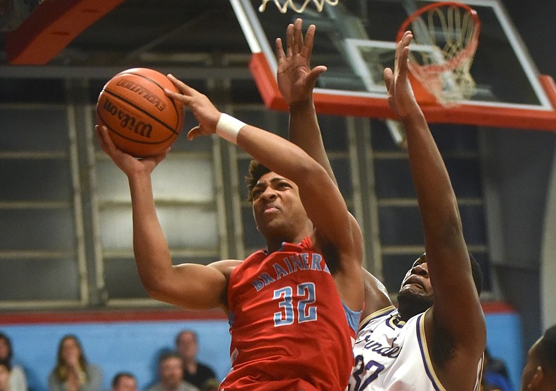 Brainerd's Jessie Walker shoots as he is guarded by Central's McClendon Curtis Tuesday, February 23, 2016 at Brainerd High School.