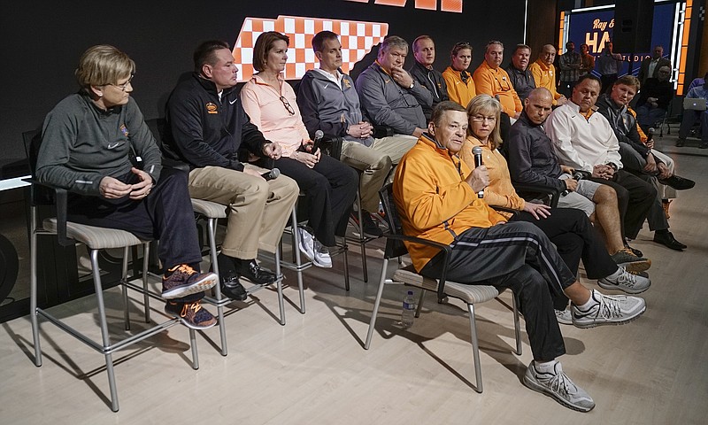 Tennessee softball coach Ralph Weekly, front row left, speaks during a news conference Tuesday, Feb. 23, 2016, in Knoxville, Tenn. The school's coaches held a news conference two weeks after a group of unidentified women sued the school over its handling of sexual assault complaints made against student-athletes. Seated to the right of Weekly is his wife and co-coach, Karen Weekly. (AP Photo/Patrick Murphy-Racey)