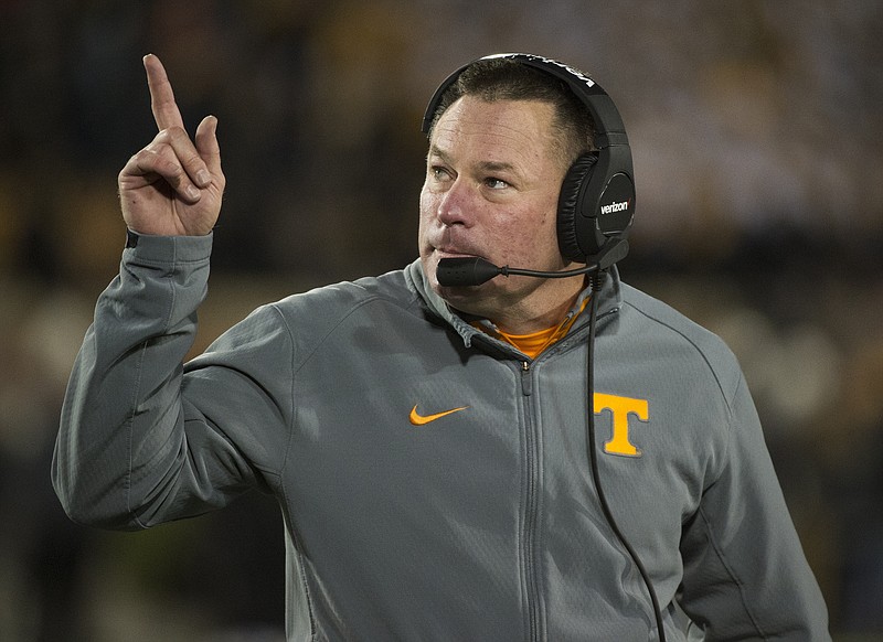 
              FILE - In this Nov. 21, 2015 file photo, Tennessee head coach Butch Jones points to the scoreboard during the first quarter of an NCAA college football game against Missouri in Columbia, Mo. Tennessee head coaches will hold a rare joint press conference Tuesday morning, Feb. 23, 2016, two weeks after a group of unidentified women sued the school over its handling of sexual assault complaints made against student-athletes. Athletic department spokesman Ryan Robinson said Monday night the coaches decided they wanted to make themselves available to answer questions on a variety of issues. (AP Photo/L.G. Patterson, File)
            