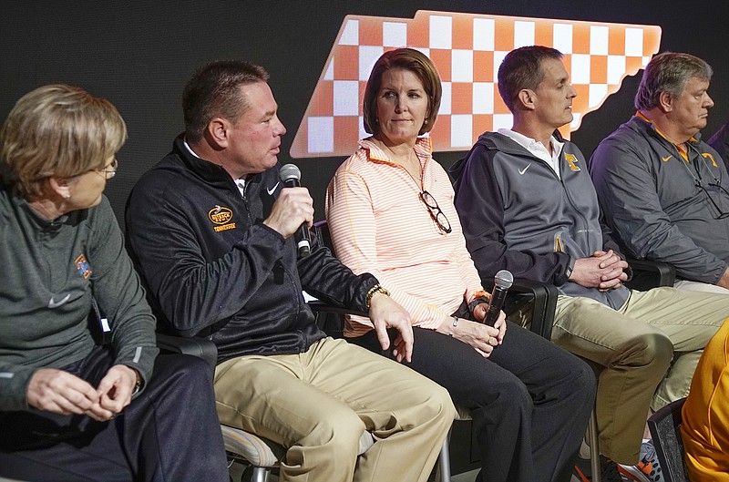 Tennessee head football coach Butch Jones, second from left, speaks during a news conference Tuesday, Feb. 23, 2016, in Knoxville.