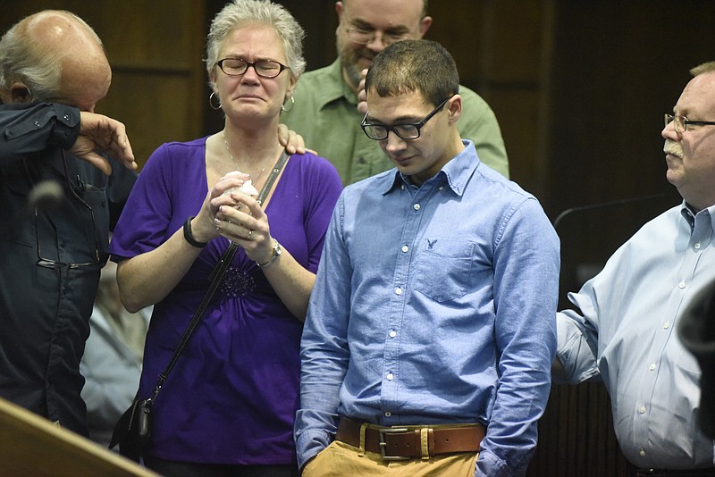 Logan Whiteaker, center, stands with members of his family as he and others are honored at Drug Court graduation on Monday, Feb. 22, 2016, in Chattanooga. Less than one day after Hamilton County Drug Court celebrated the graduation of 11 participants, Whiteaker was found dead in a Red Bank home, a hypodermic needle next to him on the floor and a small amount of suspected heroin on the bathroom counter, according to a police report.
