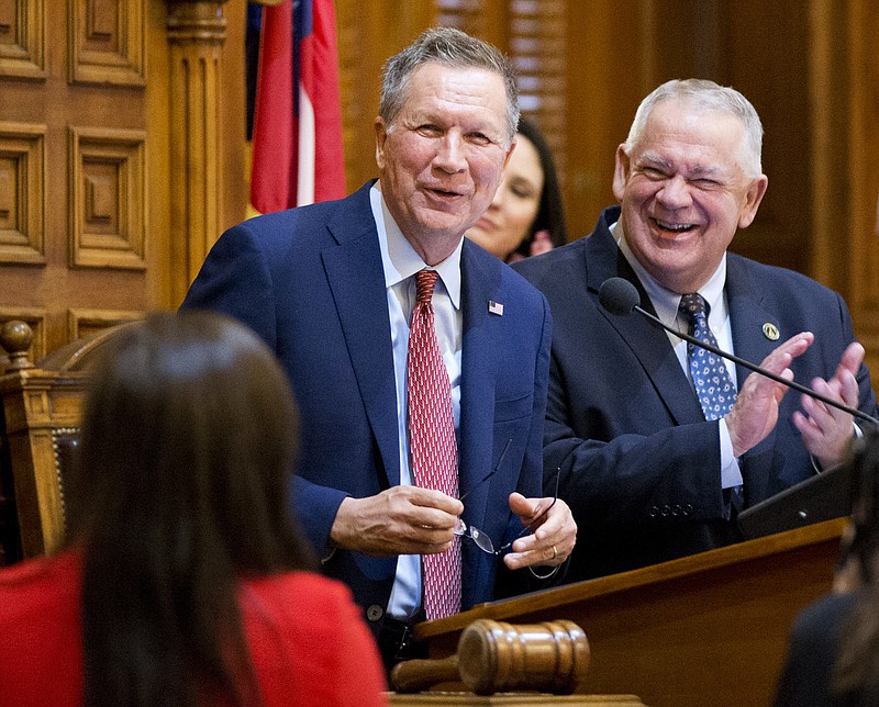 Republican presidential candidate, Ohio Gov. John Kasich, left, speaks on the House floor as Speaker David Ralston, right, looks on at the Georgia Capitol, Tuesday, Feb. 23, 2016, in Atlanta.