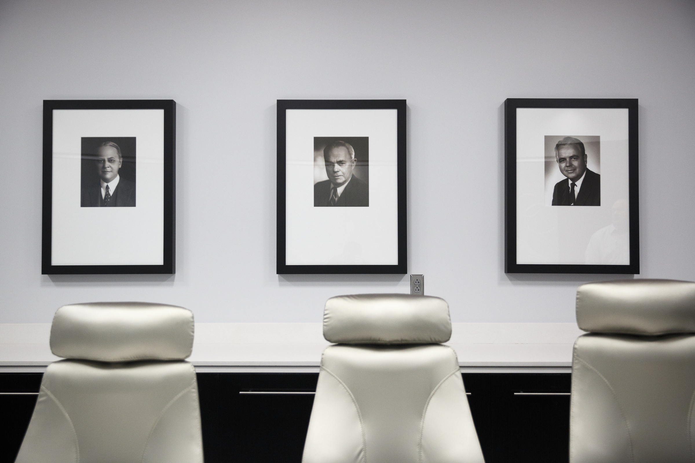 Portraits of Crawford T. Johnson the 1st, 2nd, and 3rd, from left, hang in a board room in the new Coca-Cola Bottling Company United divisional headquarters on Sheperd Road on Friday, Feb. 19, 2016, in Chattanooga, Tenn. The $67 million facility is at the site of the old Olan Mills campus.
